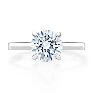 Classic Four Prong Round Cut Solitaire Diamond Engagement Ring with Peekaboo Diamond